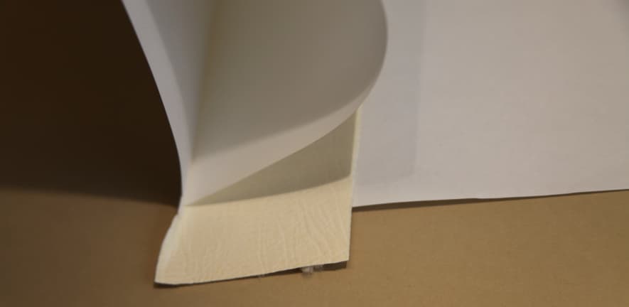 A carefully pared alum-tawed joint and a paper waste-sheet are tipped on to the parchment bifolium along the spine-fold.